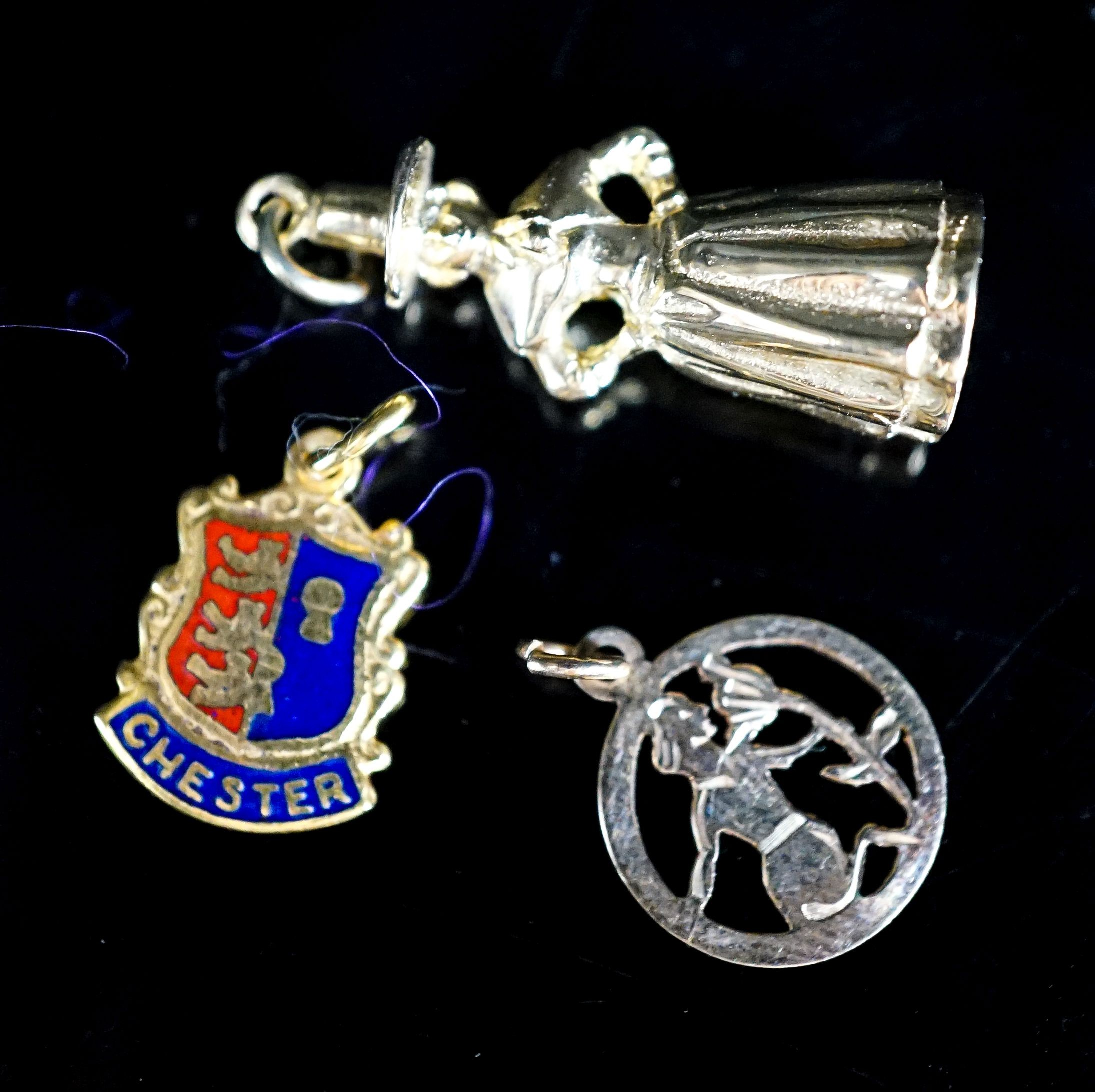 Three assorted 9ct gold charms, including St. Christopher, 6.8 grams.